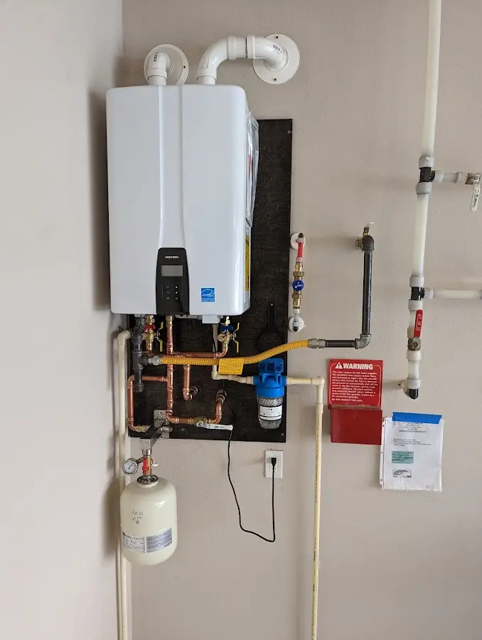 Professional plumber installing copper piping in a Yorkshire home